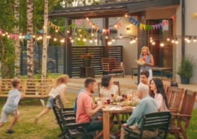 family gathered in their backyard on a summer day